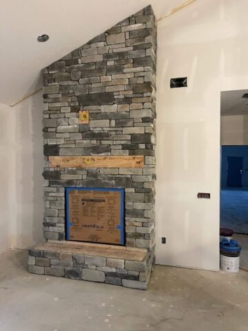 floor-to-ceiling-stone-fireplace