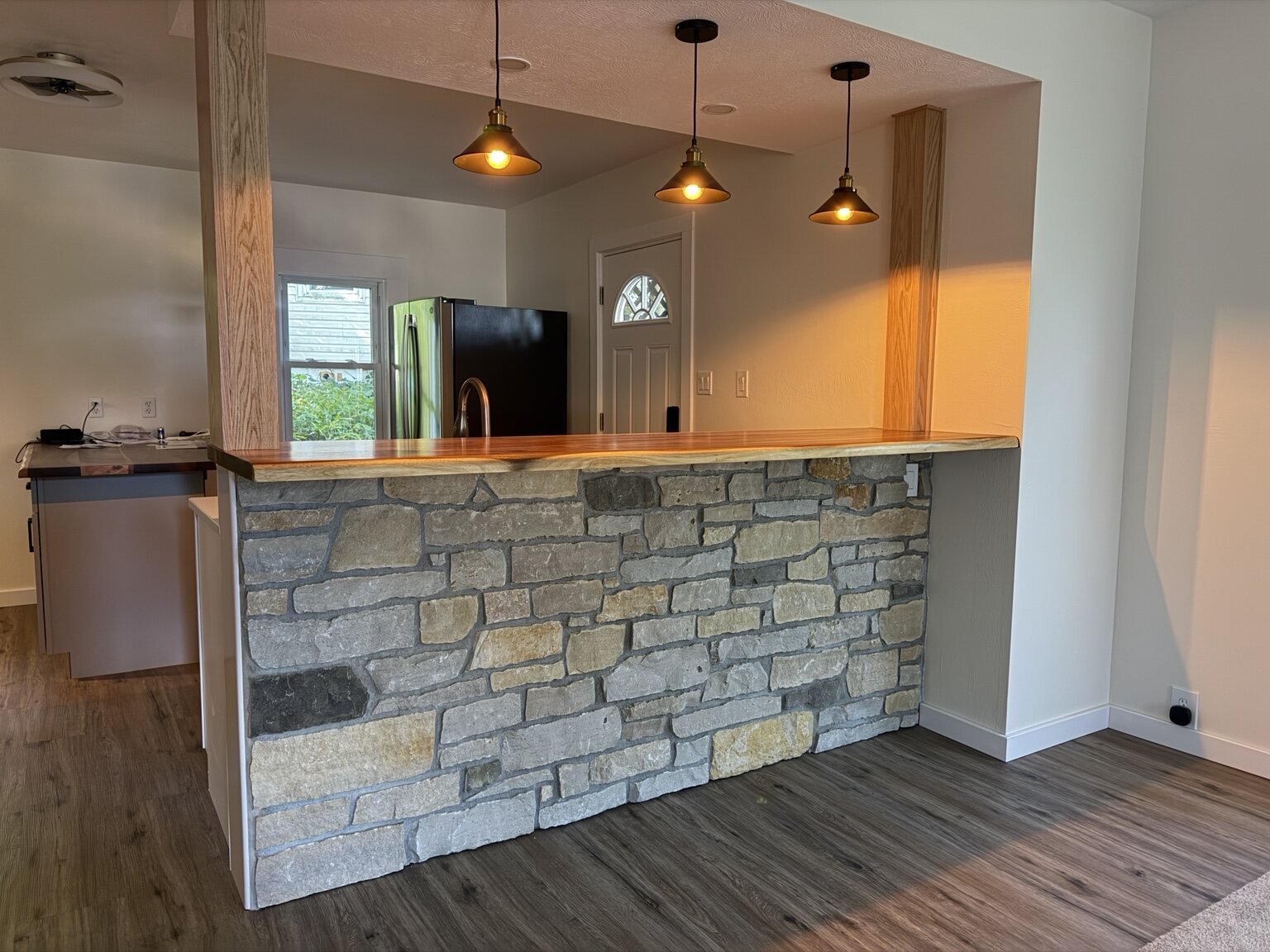Natural stone bar with wood countertop