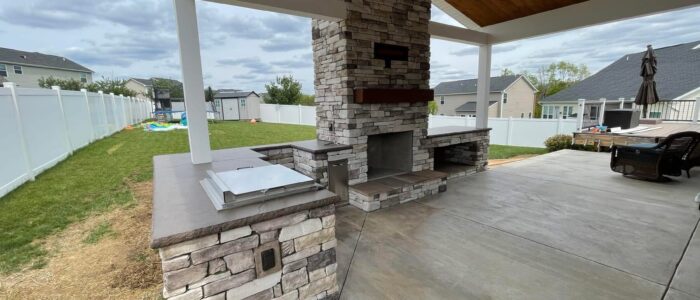 outdoor-stone-kitchen-and-fireplace
