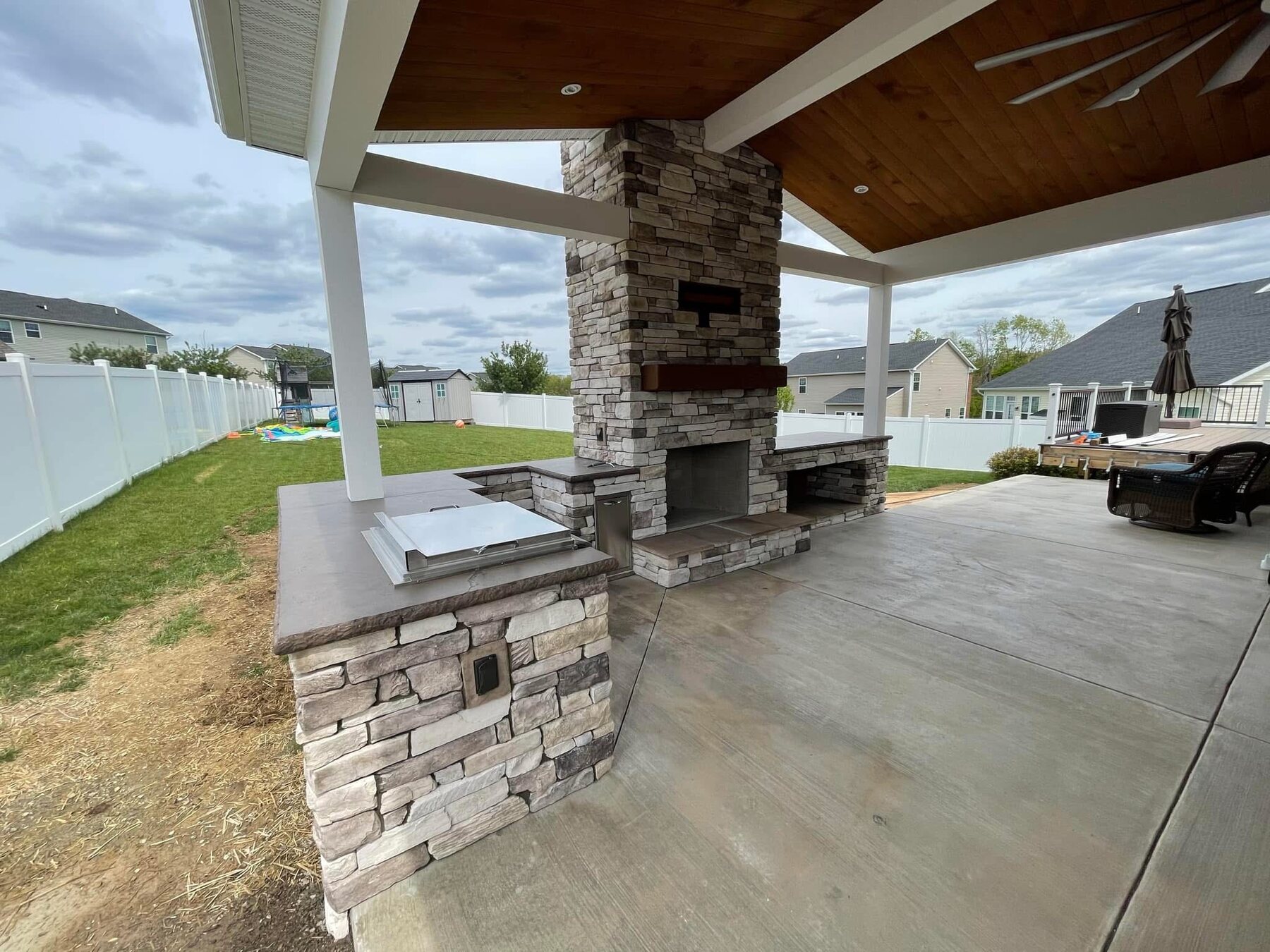 Outdoor stone kitchen and fireplace