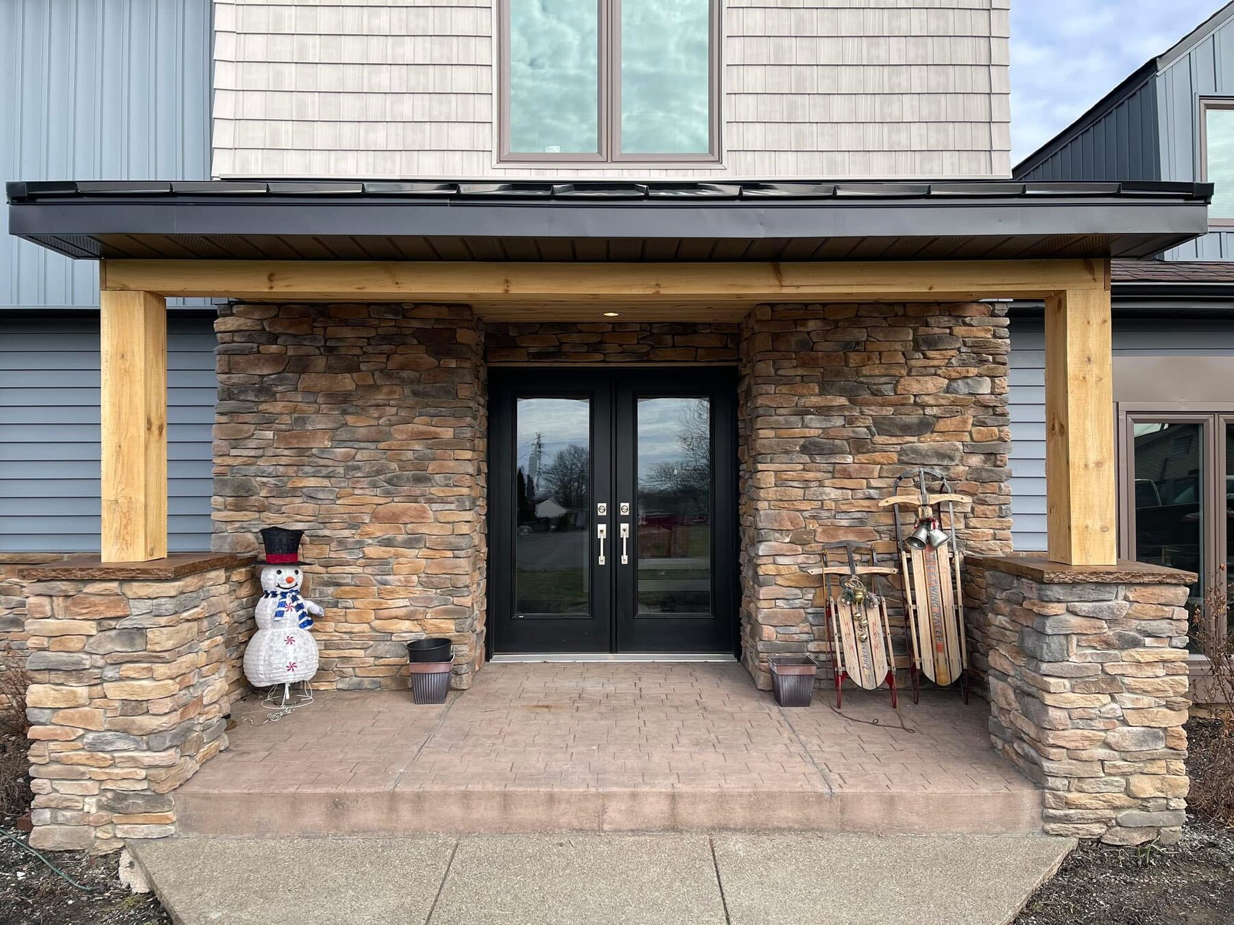 Stone entry columns and porch